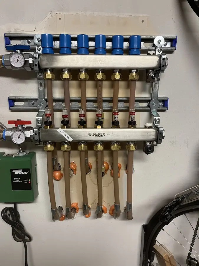 Plumber performing Water Heater Repair at a residential property in River Rouge